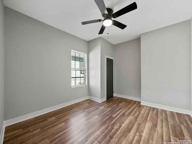 unfurnished bedroom featuring hardwood / wood-style floors and ceiling fan