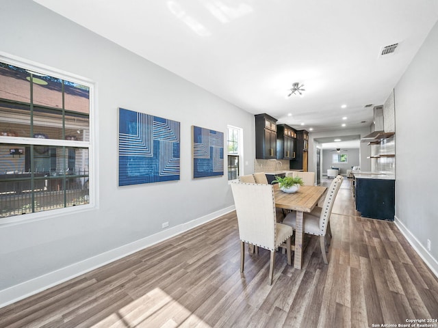 dining area with hardwood / wood-style floors and plenty of natural light