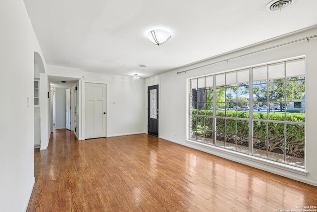 spare room featuring hardwood / wood-style floors