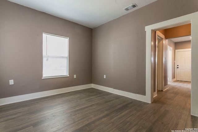 spare room featuring dark hardwood / wood-style floors