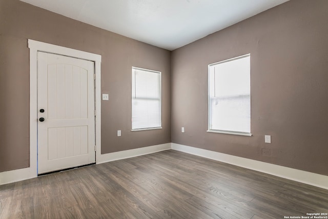 interior space with dark hardwood / wood-style flooring