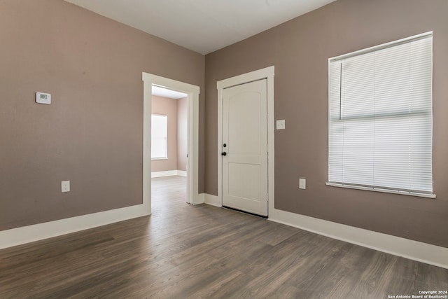 spare room with dark wood-type flooring