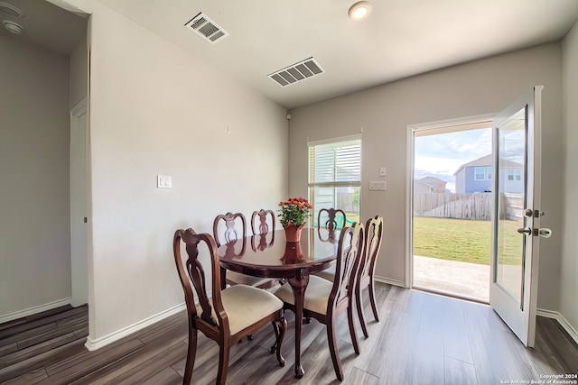 dining area featuring dark wood-type flooring