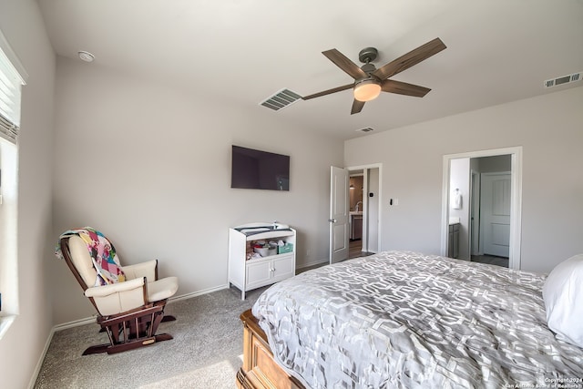 carpeted bedroom with ceiling fan and connected bathroom