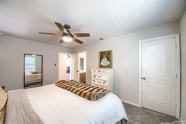 carpeted bedroom featuring ensuite bathroom and ceiling fan