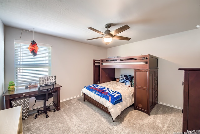 bedroom with ceiling fan and light carpet