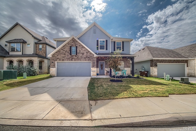 view of front of home with a front lawn and a garage