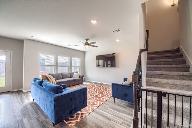 living room with ceiling fan and wood-type flooring