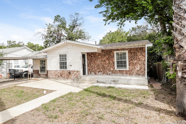 ranch-style home with a front yard