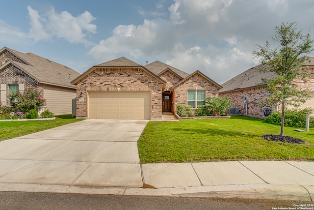 view of front facade with a garage and a front yard