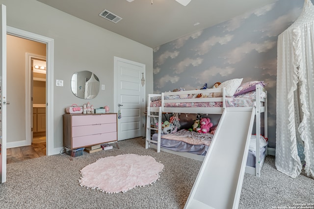 bedroom featuring ceiling fan and light carpet