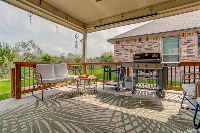 deck with area for grilling and a patio