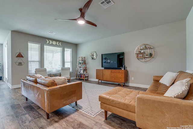 living room featuring hardwood / wood-style flooring and ceiling fan