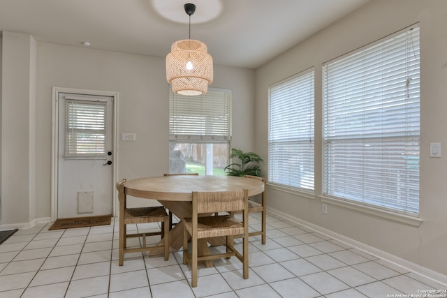 dining area with a healthy amount of sunlight and light tile patterned floors