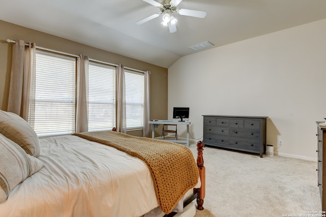 carpeted bedroom featuring vaulted ceiling and ceiling fan