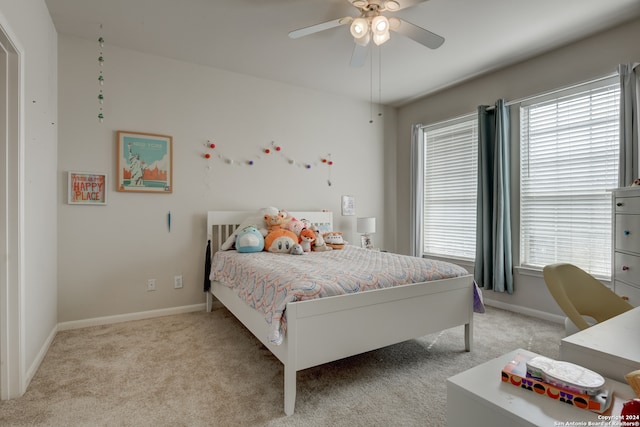 bedroom featuring light carpet and ceiling fan