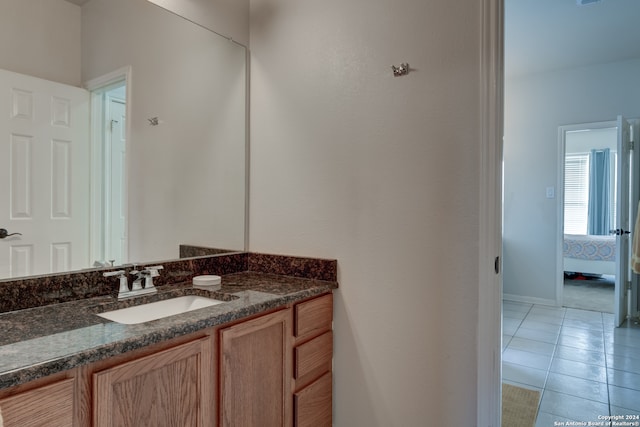 bathroom with vanity and tile patterned flooring