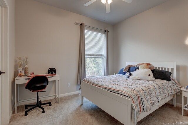 bedroom with light carpet and ceiling fan