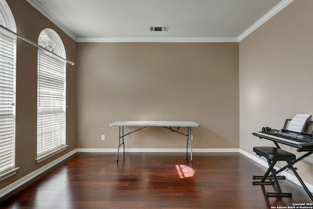 miscellaneous room featuring dark hardwood / wood-style floors and crown molding