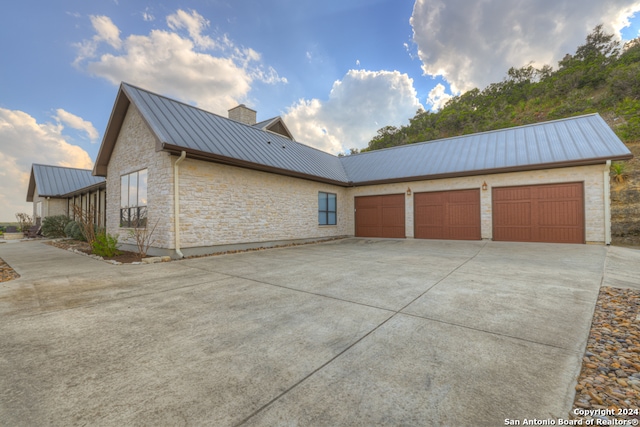 view of property exterior with a garage