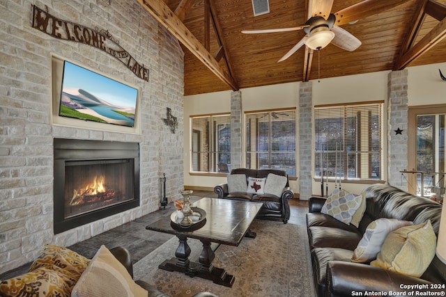 living room with wooden ceiling, ceiling fan, beam ceiling, high vaulted ceiling, and a fireplace