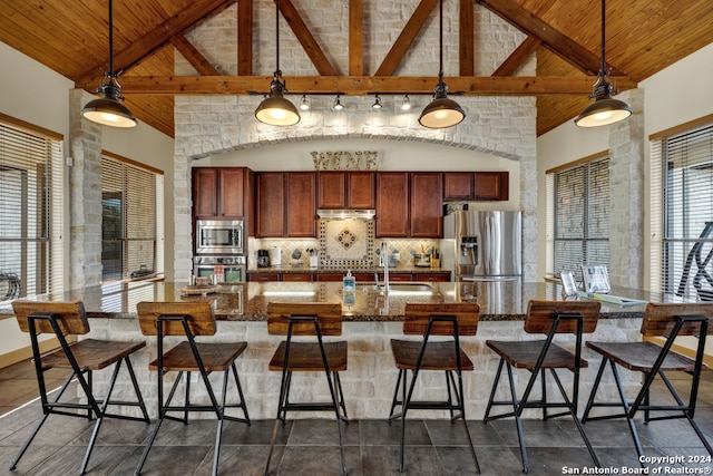 kitchen featuring sink, pendant lighting, and appliances with stainless steel finishes