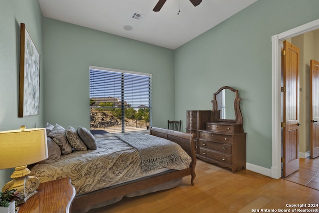 bedroom featuring light hardwood / wood-style floors and ceiling fan