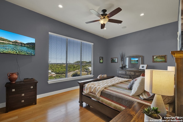 bedroom featuring light wood-type flooring and ceiling fan