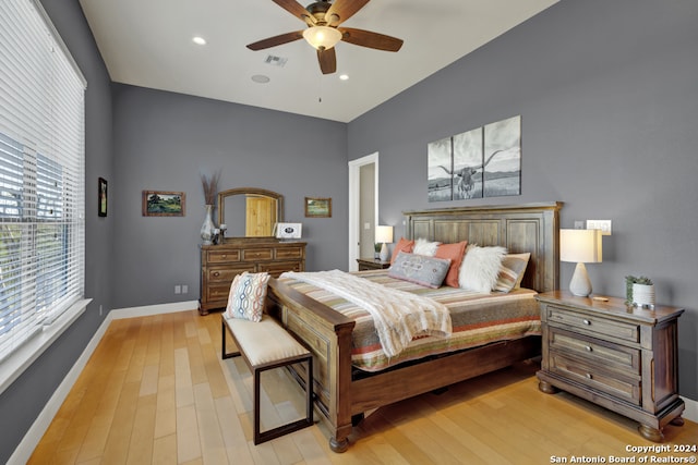 bedroom with ceiling fan and light wood-type flooring