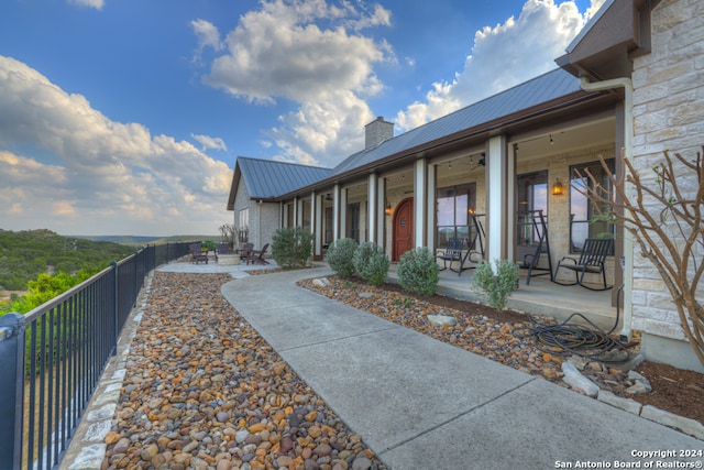 doorway to property with a patio