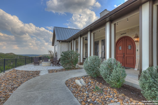 doorway to property with a patio