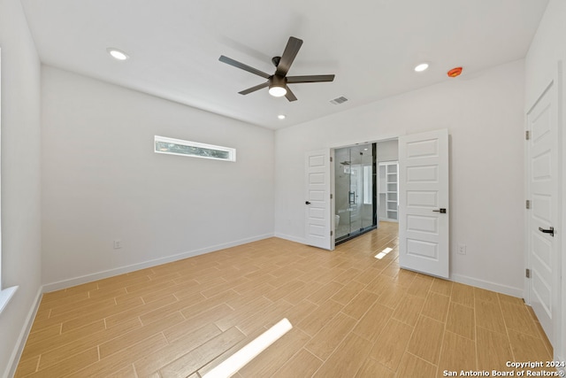 spare room featuring light hardwood / wood-style floors and ceiling fan