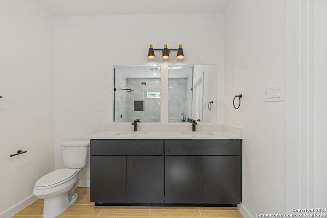 bathroom with hardwood / wood-style floors, walk in shower, vanity, and toilet