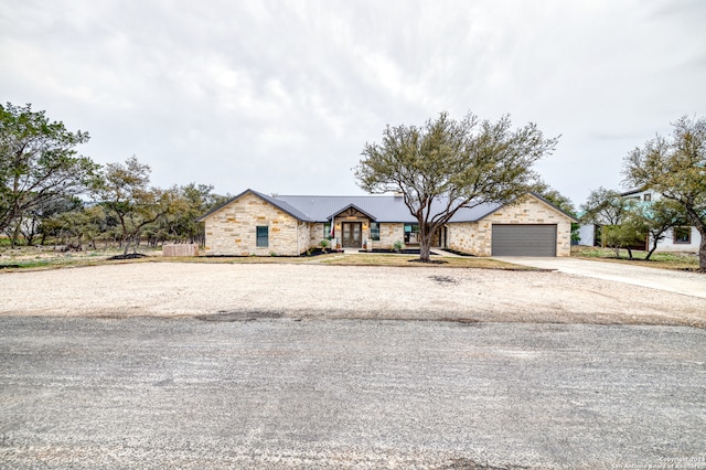 ranch-style house featuring a garage