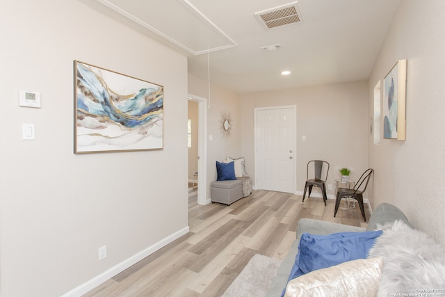 sitting room featuring light wood-type flooring