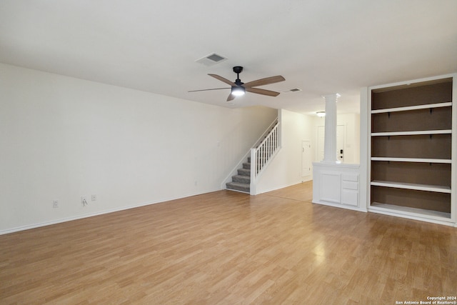 unfurnished living room with light wood-type flooring, ornate columns, and ceiling fan