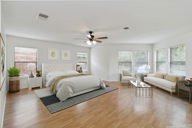 bedroom featuring light wood-type flooring and ceiling fan