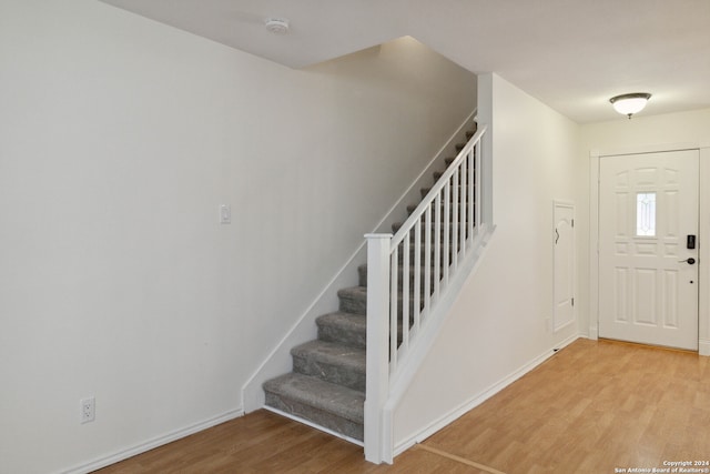 foyer entrance with hardwood / wood-style flooring