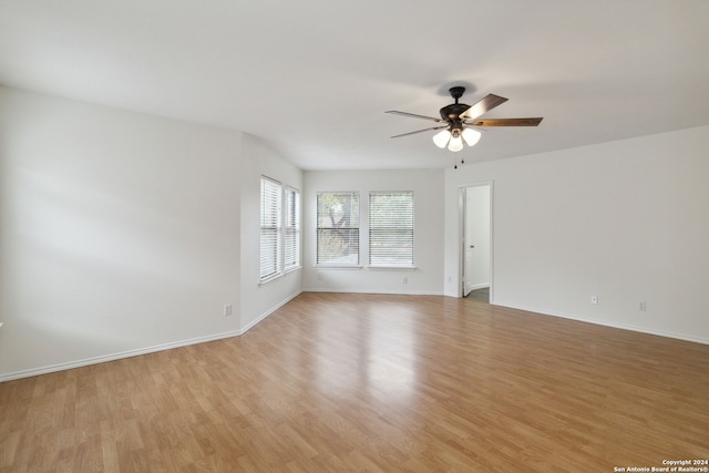 empty room featuring light hardwood / wood-style floors and ceiling fan