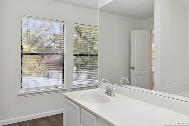 bathroom featuring vanity and wood-type flooring