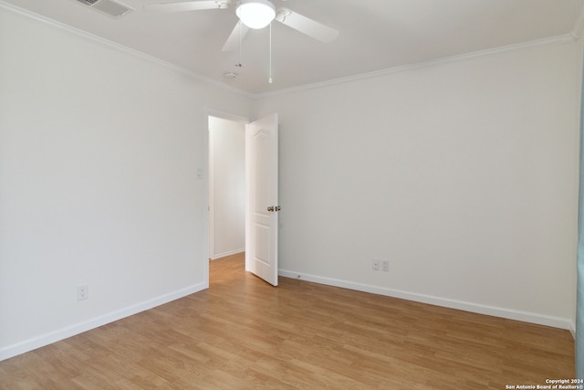 empty room featuring light hardwood / wood-style floors, ceiling fan, and ornamental molding