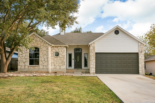 single story home featuring a garage and a front yard