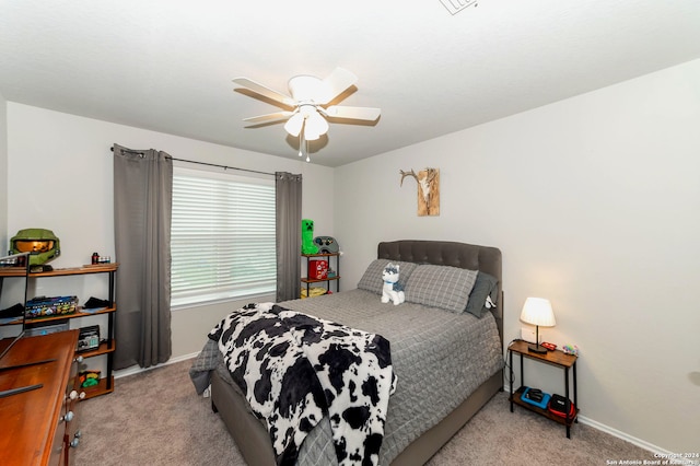 carpeted bedroom with ceiling fan