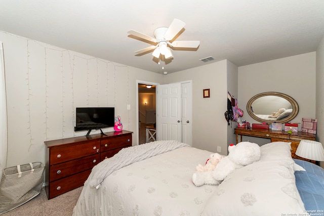 bedroom featuring light carpet and ceiling fan