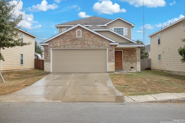 view of front facade featuring a garage and a front yard