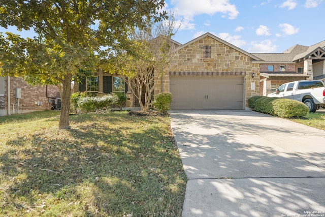 view of front of home featuring a garage and a front yard