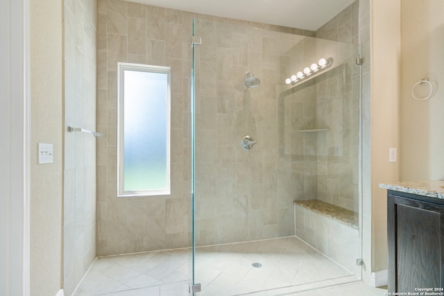 bathroom with vanity and walk in shower