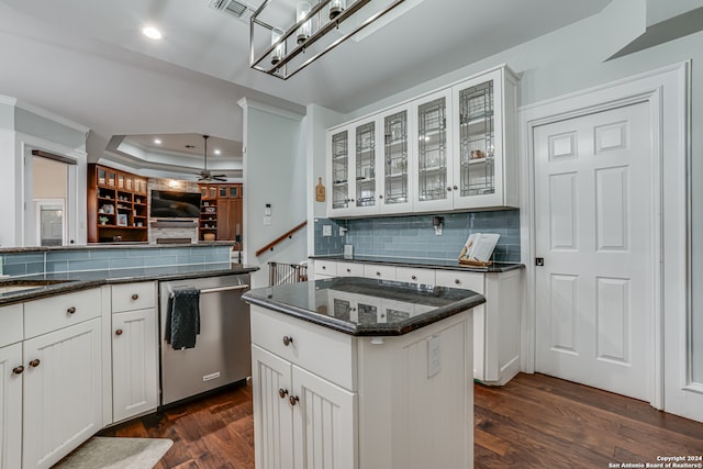 kitchen featuring dark wood-type flooring, white cabinetry, dishwasher, ceiling fan, and a center island