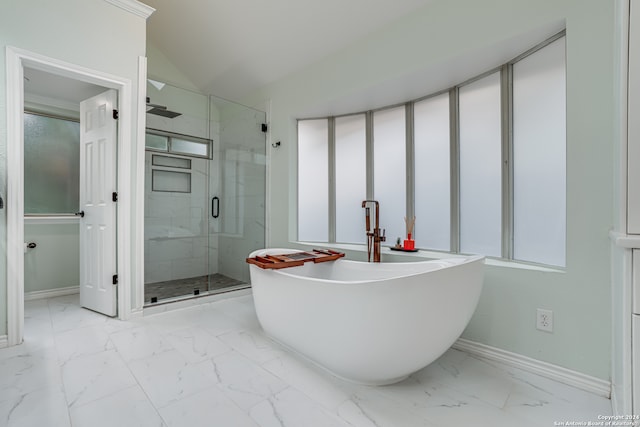 bathroom featuring plus walk in shower and lofted ceiling