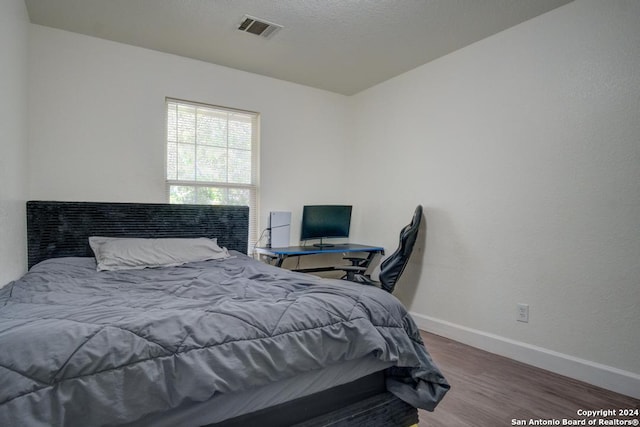 bedroom featuring hardwood / wood-style floors